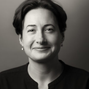 Headshot of our Founder Fran Perrin OBE in grayscale.