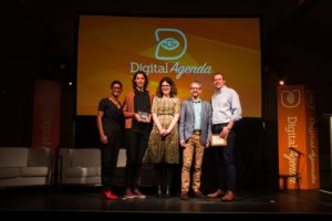 Photo of the team being presented with the Digital Impact Award
